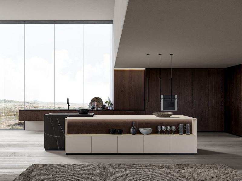 Isola CX 10 ultramat talpa con maniglia. Top, spalle e schienali ceramica Kelya Natural. Top e spalle ceramica Blanco Plus Abujardado Pacific. Basi sospese e colonne CX 10 essenza rovere termotrattato con maniglia.