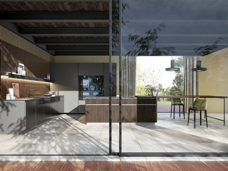 Basi isola e spalle CX 13 essenza rovere castoro. Top isola in pietra naturale grigio Carnico con invaso perimetrale. Basi e colonne CX 13 laccato metallo anodizzato. Top ceramica Kelya Natural.